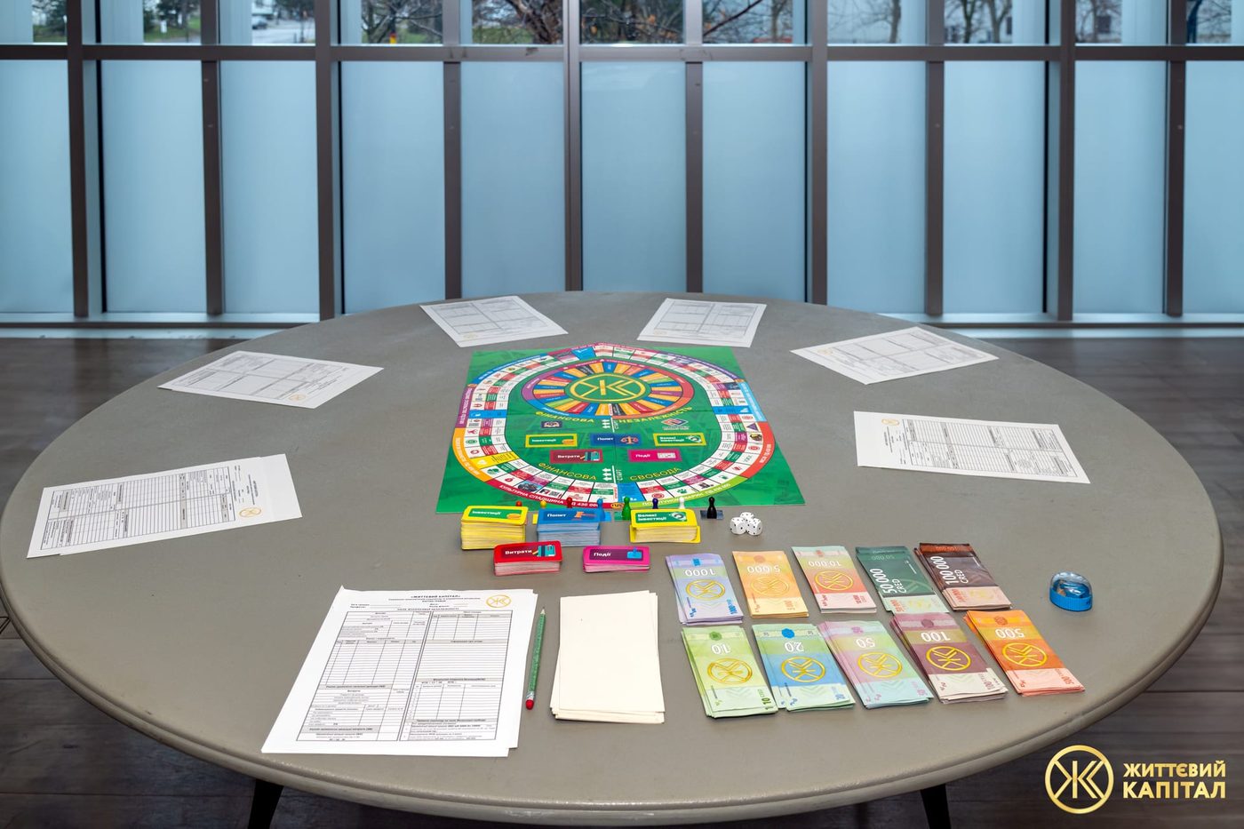 The Life Capital board with player ledgers and card decks laid out for a session.